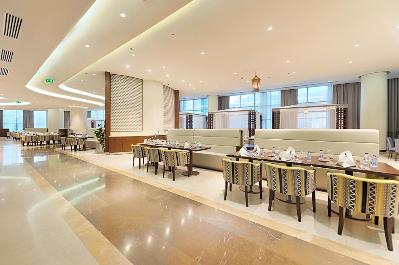 Holiday Suites Al Azizia La Mecque Extérieur photo The hotel's restaurant
